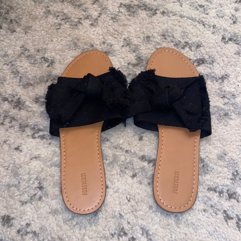 Black slide sandals with bow